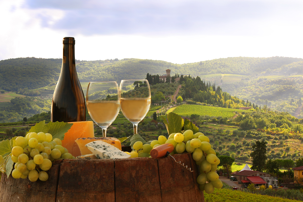 White wine with barrel on vineyard in Chianti Tuscany Italy 154393475